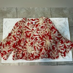 Diane Furstenberg red print shear top gently worn.